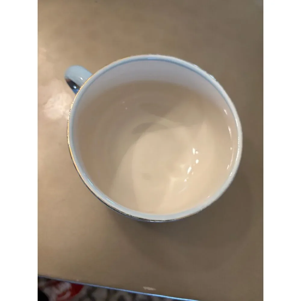 Anthropology Light blue and brown “mE!” mug